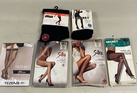 All six hosiery items laid out showing packaging fronts