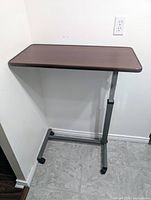 Full view of the table showing top surface, frame, and casters