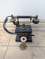 front view showing handset, body, rotary dial, detached dial plate