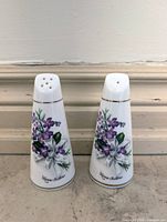 Front view of both shakers showing violet design, Nova Scotia text