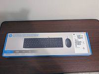 Front of sealed HP 320MK keyboard and mouse combo box