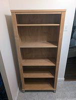 Front view of bookcase showing five shelf levels
