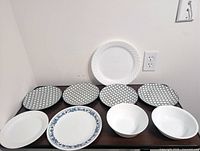 All nine dinnerware pieces laid out on table