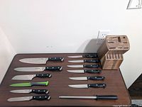 All knives, block and steel laid out on table