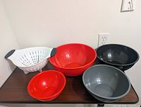 All five plastic kitchen pieces aligned on table