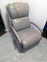Front angled view showing entire recliner, upholstery, arms, lever
