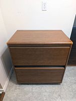 Front view of two-drawer wood veneer lateral file cabinet