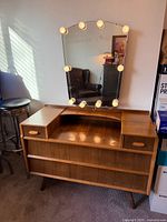 Front view showing full dresser, mirror, LED lights, drawers and shelf