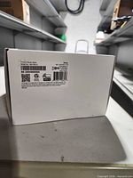 Side view of box with product label showing model designation, barcodes and certifications