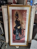 Tall narrow caricature print framed in gold-tone frame
