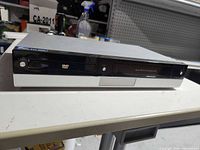 Front view showing DVD tray and VHS slot