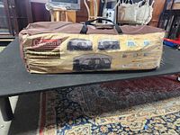 Coleman Hampton 9-person tent in brown carry bag full view