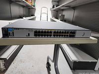 Front view of HP ProCurve 3500yl-24G-PoE+ switch showing 24 Ethernet ports and chassis
