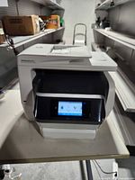 Front view of HP OfficeJet Pro 8740 powered on showing touchscreen