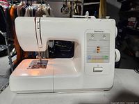 Front and left side view of Kenmore sewing machine showing overall condition