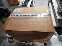 sealed shipping carton with AMS tape