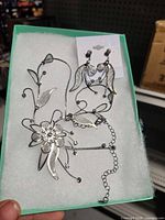 Necklace and earrings set displayed in box