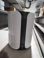 Front view of Miko air purifier showing power button and air intake slots