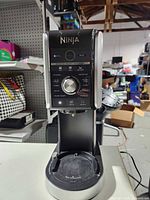 Front view of Ninja Creami Deluxe base showing control panel