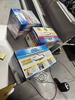 Three boxed Rust-Oleum EpoxyShield kits on workbench