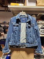 Front view of Talbots denim jacket on hanger