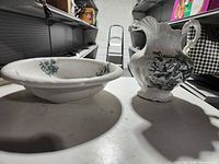 Pitcher and washbasin displayed side by side