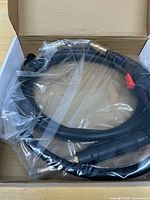 Box interior showing torch lead sealed in plastic