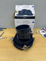 Box and stacked blue dinnerware showing quantity and color