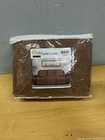 Front view of sealed Easy-Going sofa cover package