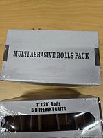 Top view of sealed box labeled 'MULTI ABRASIVE ROLLS PACK'