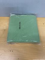 Sealed green chair carpet front view with 'MADE IN CHINA' text