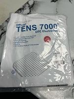 Front of sealed TENS 7000 OTC Electrodes package showing product details
