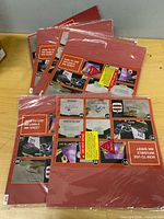 All five packs stacked on table showing sealed packaging and front instruction graphics