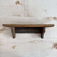 Front view of rustic live edge wooden wall shelf