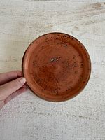 Front view of orange speckled plate