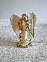 Full front view of angel ornament standing upright