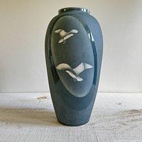 Front view showing seagull motif and overall glaze