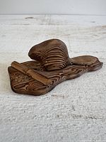 overall view of carved beaver figurine on base