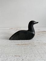 Right side profile of stone bird