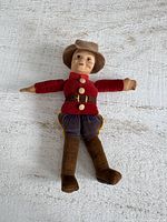 Full view of Norah Wellings RCMP fabric doll front