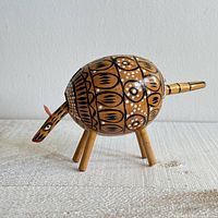 front angled view of wooden armadillo figurine