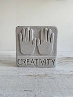 Front view showing raised hands and text