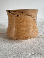 Front view of burl wood vase showing grain and spalting