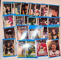 Spread of hockey trading cards showing blue-border Score 1990-91 design and various players