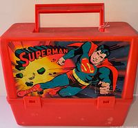 Front view showing Superman decal, handle, latches