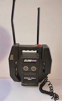 Front view of GI Joe Mobile Field Unit showing antennas, dials, logo and coiled cord