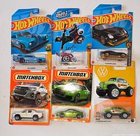 Front view of all six sealed blister-carded cars