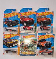 overview of six sealed Hot Wheels cars on cards