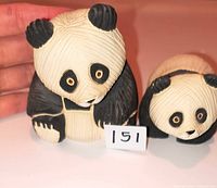 Front view of both signed Artesania Rinconada panda bear figurines showing size and coloration