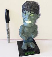 Front view of Funko The Incredible Hulk bobble head beside Sharpie for scale
